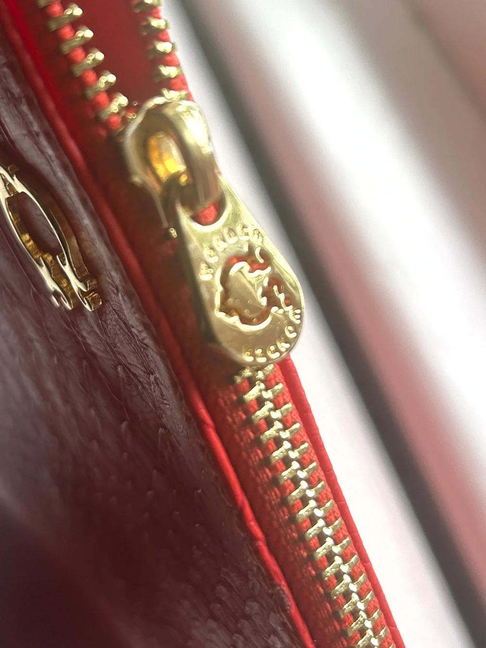 C. Wonder Clutch Orange Red Embossed Print Zip Close with Gold C Emblem